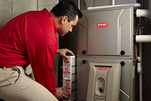 hvac service technician replace a gas furnace's air filter