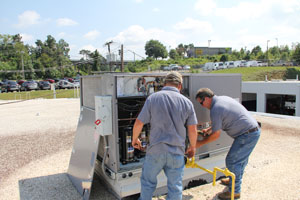 HVAC service technicians working on commercial system