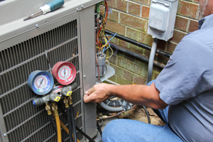 Technician performing AC inspection
